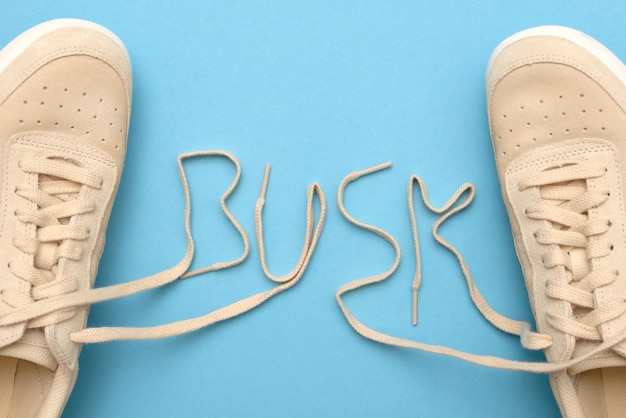 Women sneakers with laces in busk text