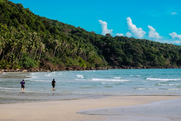 Women splashing in sea near beautiful beach