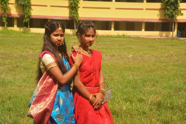 Women standing on grassy field