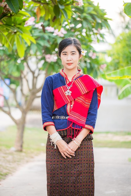 Women in thai dress at the old temple,Beautyful Thai woman wearing Thai dress and smile