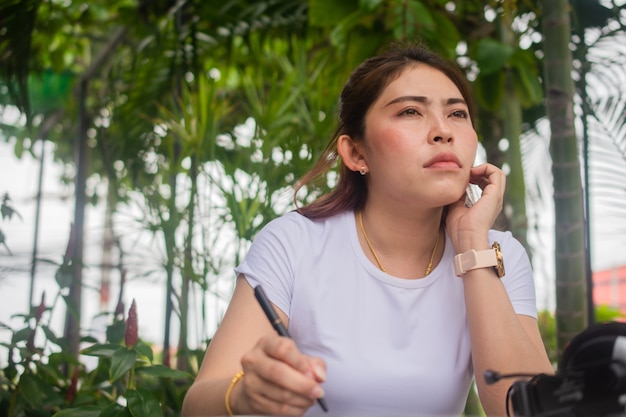 Women Think sitting work at cafe