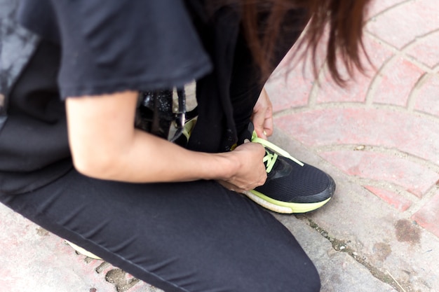 women tied rope shoes