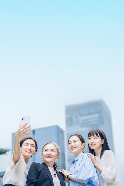 Women of various ages taking commemorative photos