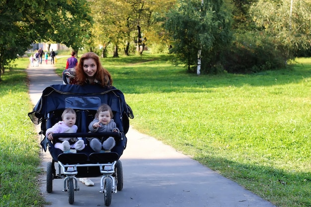 Women walk stroller summer