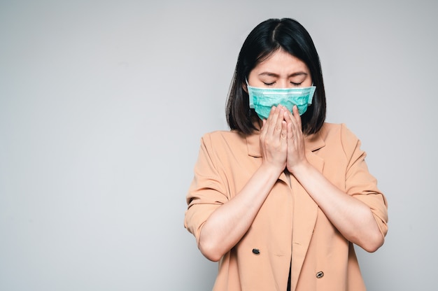 Women wear face mask sneezing and coughing