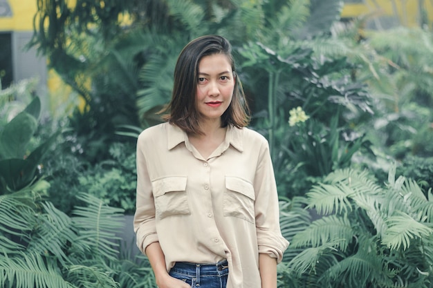 Women wearing brown shirts posing in the garden