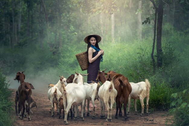 Women with goat in Thailand