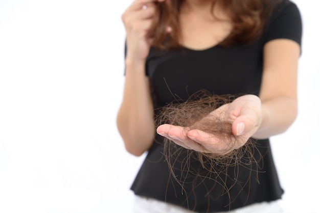 Photo women with hair problem holding loss hair in hand