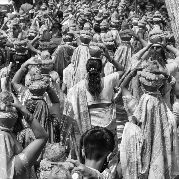 women with kalash on head during jagannath temple mangal kalash yatra indian hindu devotees