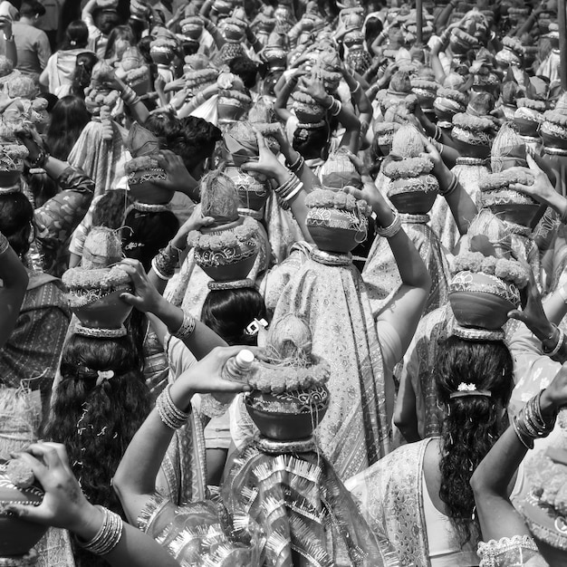 women with kalash on head during jagannath temple mangal kalash yatra indian hindu devotees