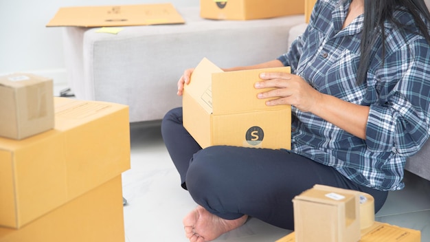 Women working freelance and packing box