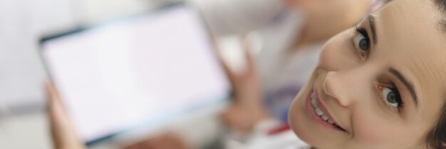 Women working in hospital spend pause with tablet device