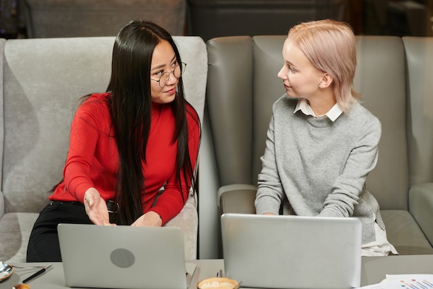 Women working online on laptop