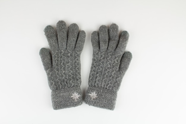 Women39s winter knitted mittens on a white background