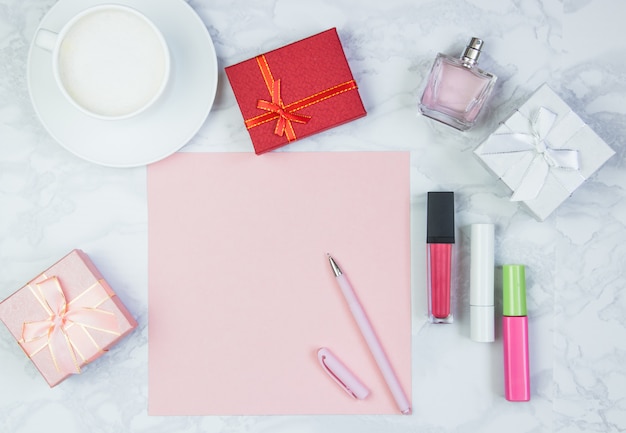 Womens accessories on a white marble table