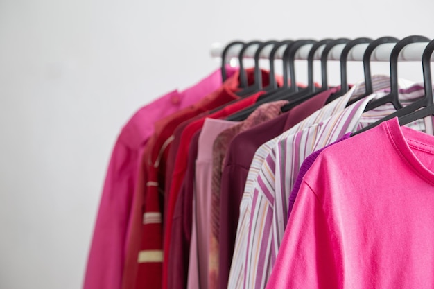 womens clothing in pink and burgundy trendy colors on a hanger