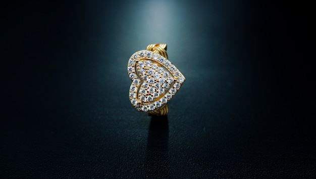 womens gold ring with a heart pattern