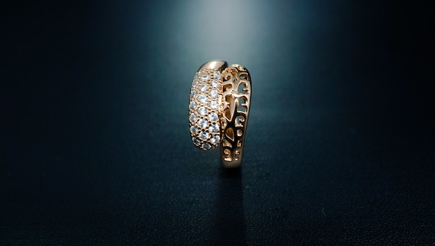 womens gold ring with motifs like two snake heads