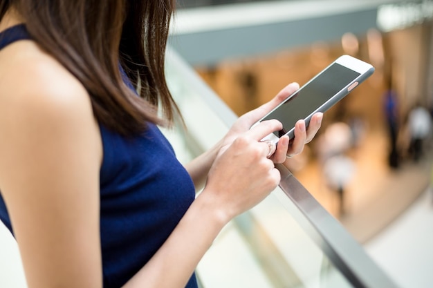 Womens hand using mobile phone