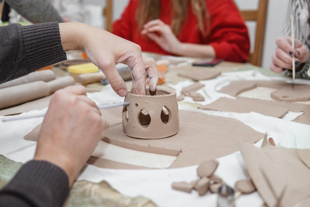 Womens hands knead clay drawing elements of the product production of ceramic products