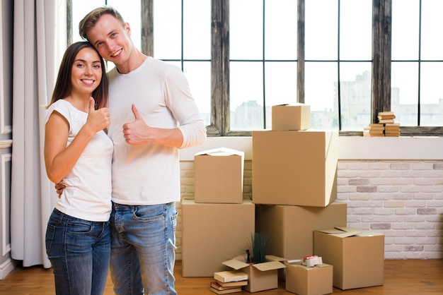 Wonderful couple showing thumbs up