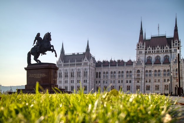 Wonderful monument rakoczi ferenc equestrian statue before
hungarian paliament building with green grass forefront in
budapest, hungary.