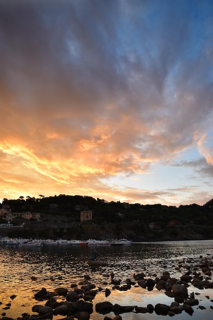 Wonderful sunrise on the beach of the Bay of Silence in Liguria a dream atmosphere