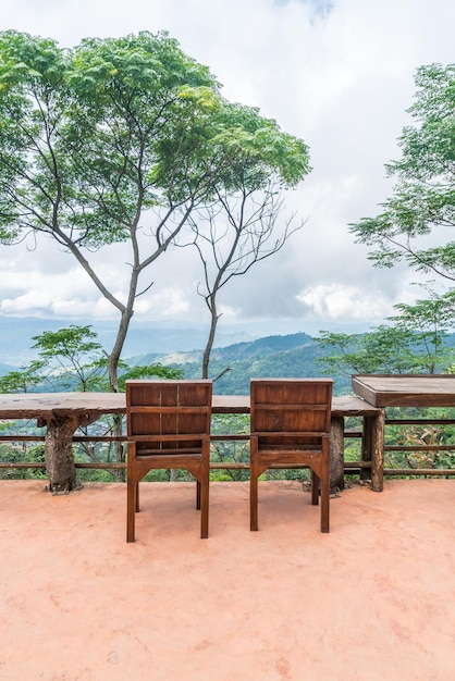 Wood bar and chair with mountain hill background