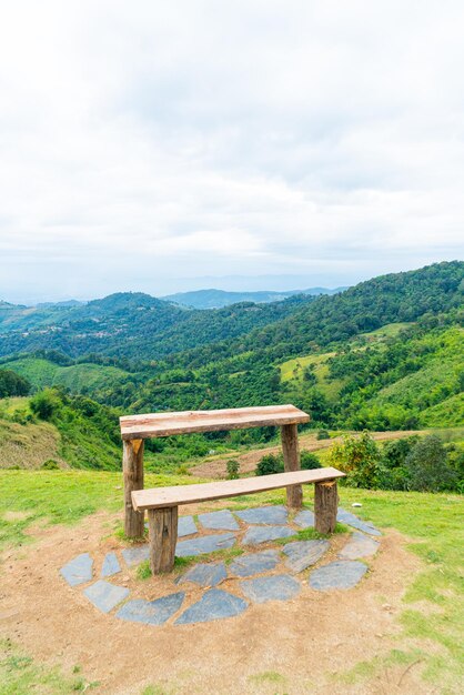 wood bar and chair with mountain hill background