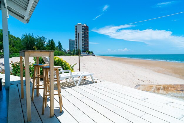 wood bar and chair with sea beach background