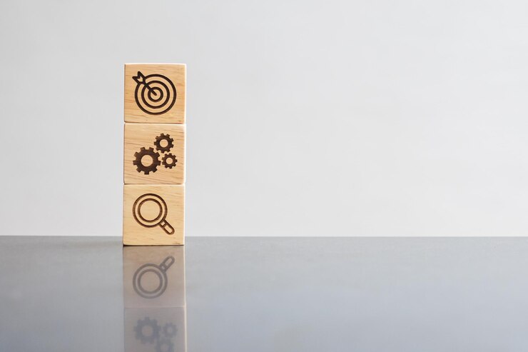 Photo wood block with business goal strategy target mission action objective teamwork brainstorm and idea concept