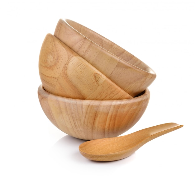 Wood bowl and wood spoon on white wall