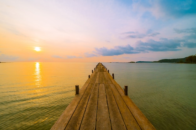 Wood bridge or pier on the beach and sea