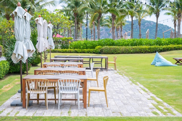 Wood chairs and wooden table dining in garden Outdoor dining area