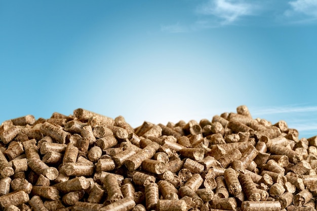 Wood chip pellets on sky background