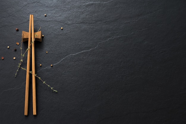 Wood chopsticks on old marble space