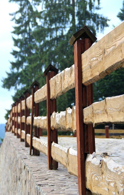 Wood Fence On A Stone Foundation For Vertical Story