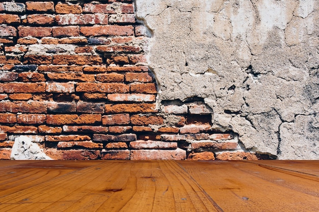 Wood floor and brick wall.