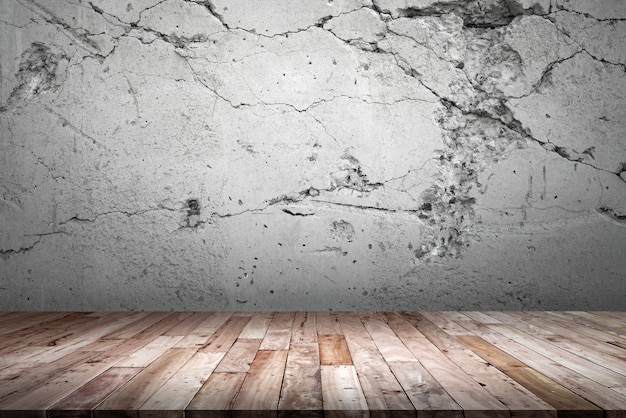 Wood floor and cement wall.