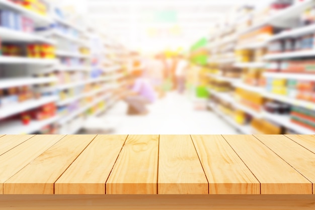 Premium Photo | Wood floor and supermarket blur background