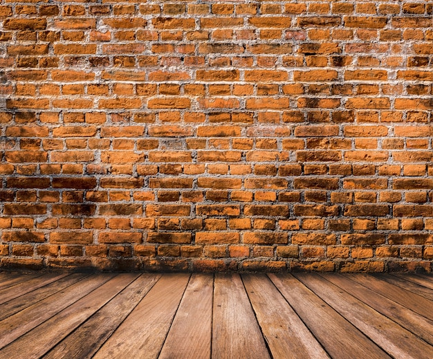 Wood floor with old brick wall surface