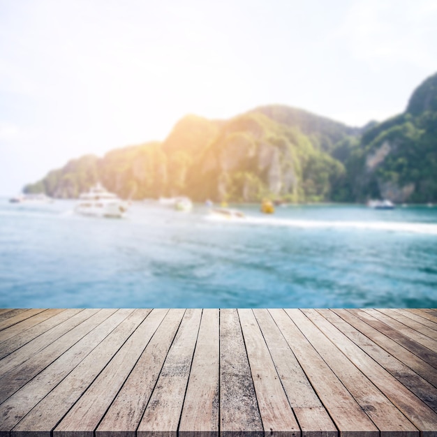 Photo wood floor or wood table with sea scape islands background for product display