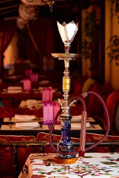 Wood hookah on table in hookah lounge Shallow dof