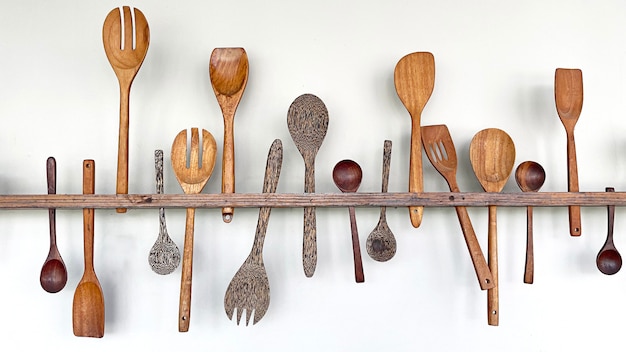 Wood Kitchen Utensils on the wall.