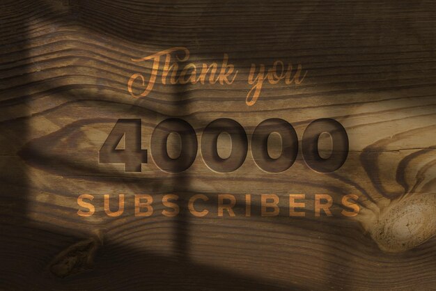 Photo a wood panel with the words thank you 40000 subscribers on it