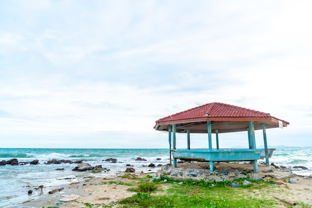 wood pavilion with beach and sea background 