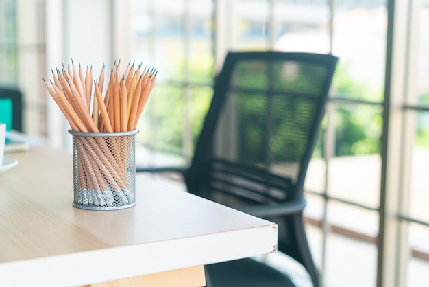 wood pencil in pencil holder on working table