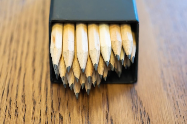 Wood pencil with pencil shavings and a wood sharpener