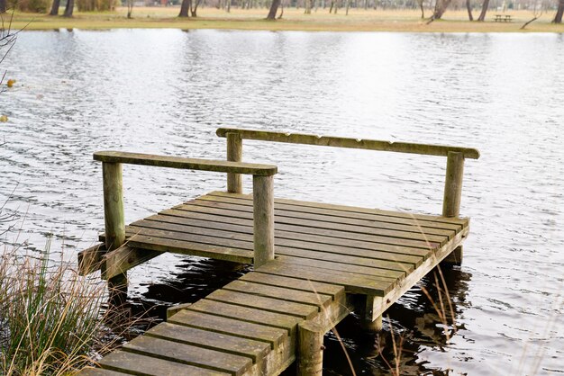 Wood pier pontoon in water lake in hourtin port France