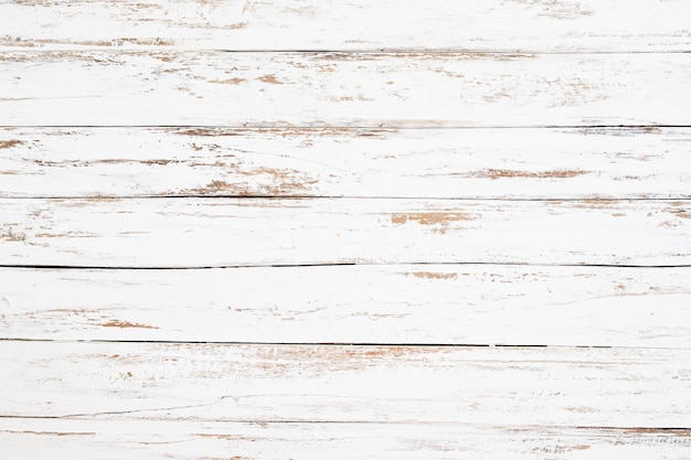 Wood plank painted in white weathered and old. Vintage and rustic white wooden background.